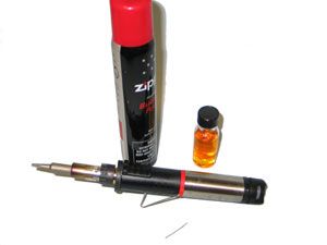 High vacuum soldering iron with butane bottle and solder flux
